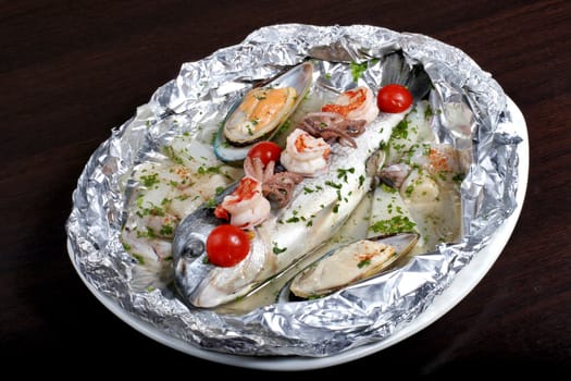 italian dish: dorado fish with seafoods