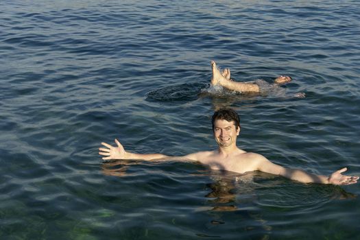 two young men at the mediterranean ocean