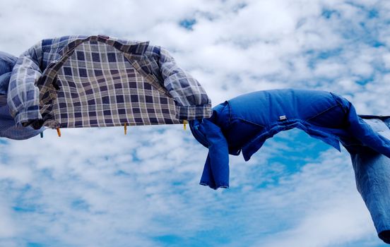 Drying shirts on wind with copy space on sky  background