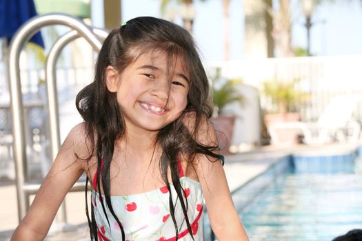 Little girl having fun at the pool