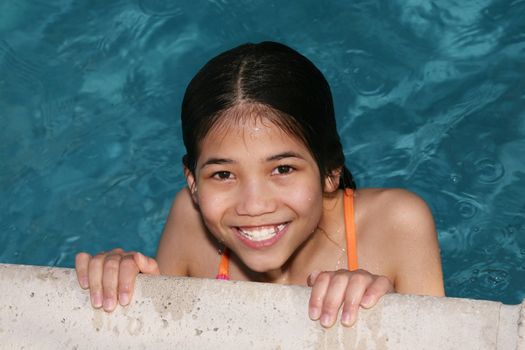 Little girl enjoying the swimming pool