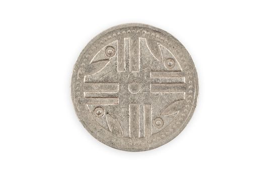 Close-up of a colombian coin with indigenous Quimbaya civilization figurine, isolated over white, with clipping path.