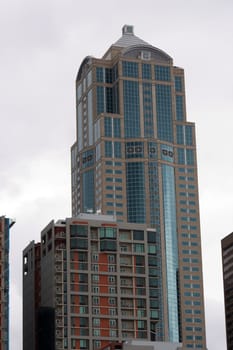 Seattle Downtown Buildings are set against a typical Seattle cloudy sky. Office buildings and apartments or condos are showcased in this framed composition.

