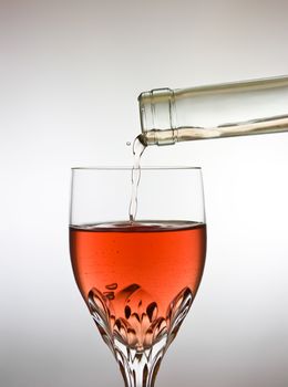 This image shows a glass of delicious red wine