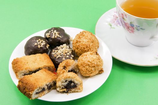 
	
chocolate biscuits with different shapes and cup of tea
