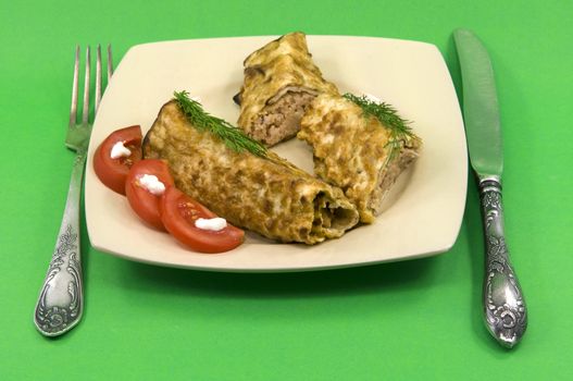 
Pancakes with meat branch of dill and tomato with mayonnaise