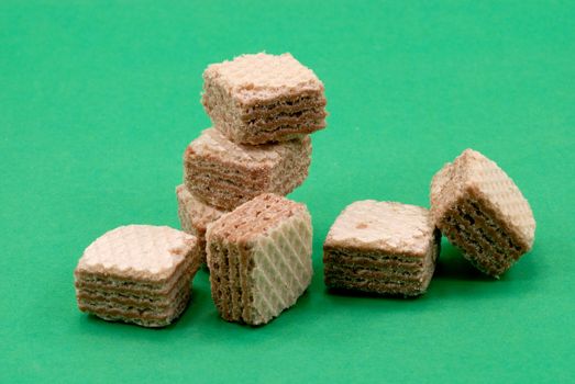 Several waffle blocks lie on the green background
