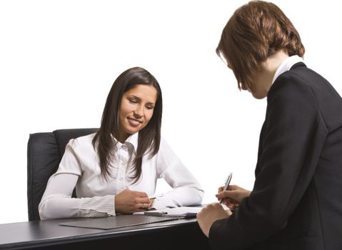 Two businesswomen signing a contract in the office. All the documents are mine.