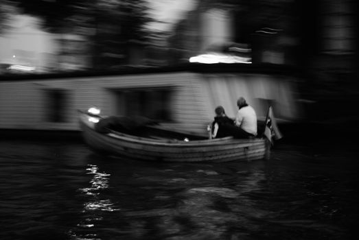 Couple in a boat in Amsterdam