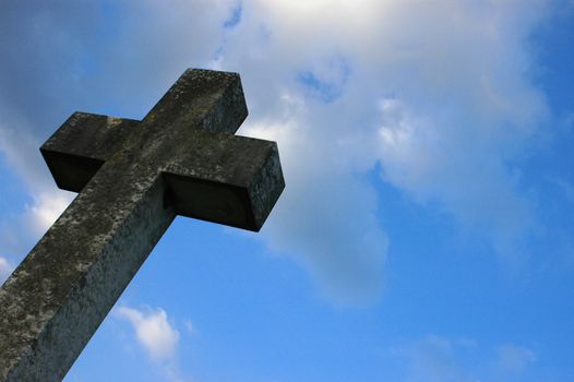 A Christian cross against a blue sky