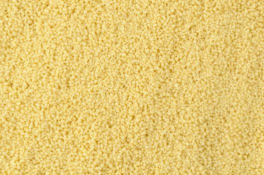 Top view of raw semolina couscous in natural light