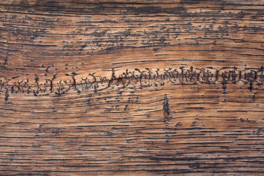 weathered wood background with wavy pattern and cracks