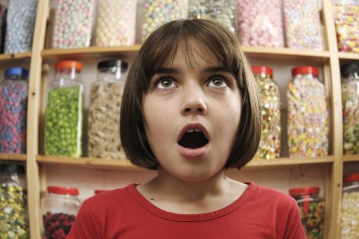 child looking in awe at sweets