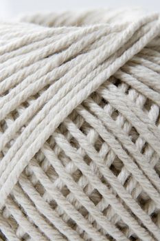 close-up section of a ball of string showing the texture and fiber of thread