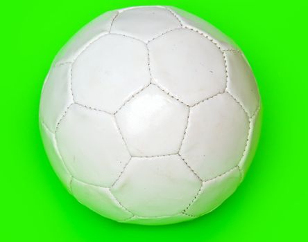 White football on a green background