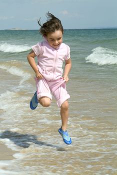 child playing by waters edge