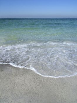 waves breaking on the beach on the gulf of mexico