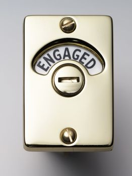 face on view of a brass engaged door lock   