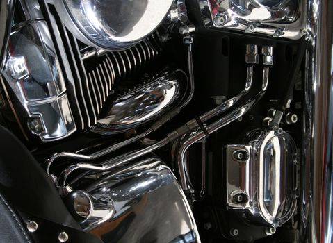 The chrome engine of a motorcycle.