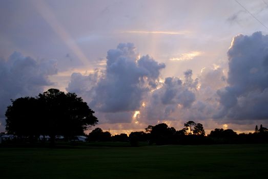 sunset rays over a golf course