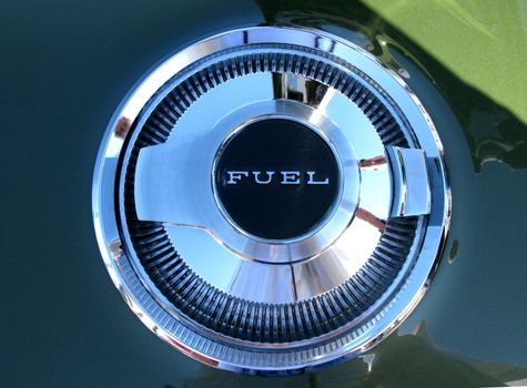 Gas cap labeled "FUEL" from a 1970's car.