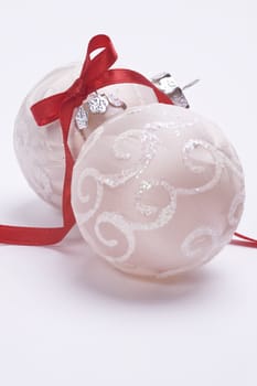 christmas balls with decorative red ribbon isolated on white background