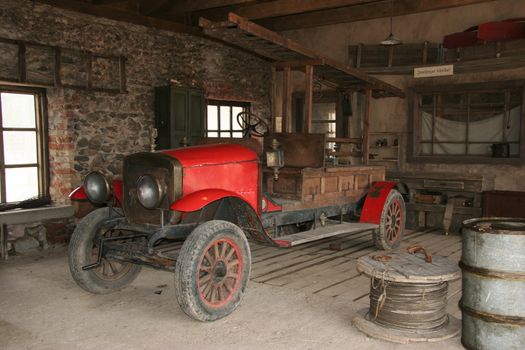Antique fire-engine at fire-department in the cinema town.
