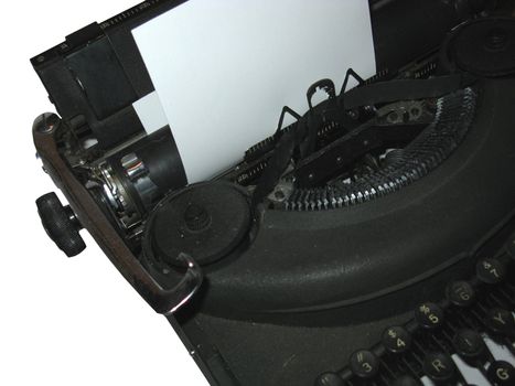 Battered vintage manual typewriter with a fresh sheet of white paper stock.