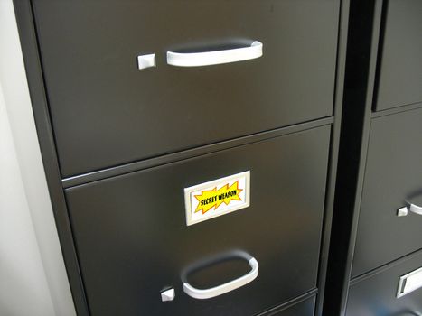 Black filing cabinet that contains the company secret weapon.