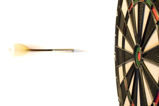 Darts hitting the bullseye on a dartboard