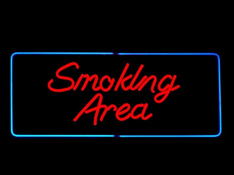 smoking area neon sign on black