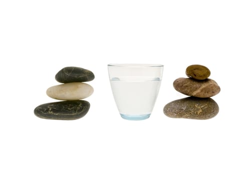 Glass filled with pure water and stones isolated on white
