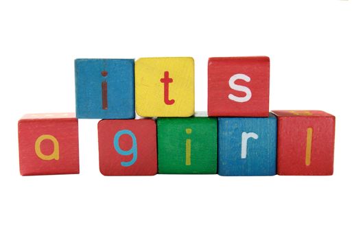 'it's a girl' in colorful children's block letters
