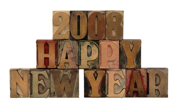 Happy New Year 2008 in letterpress wood letters in all caps isolated on white