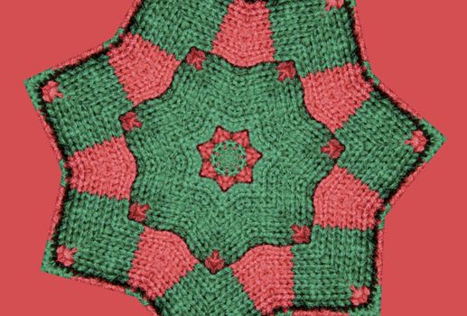 red and green star abstract with knitted texture