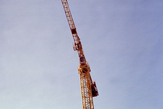Crane on blue sky background