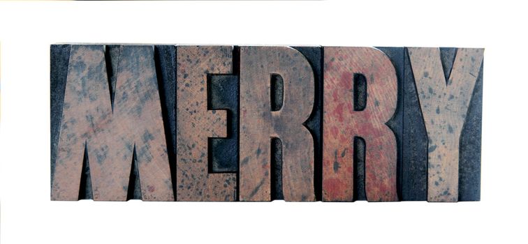 old, ink-stained wood letters spell out the word 'merry' in all caps isolated on white