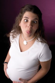 seven month pregnant women making a funny face
