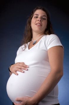 Giant 7 month pregnant women looking down
