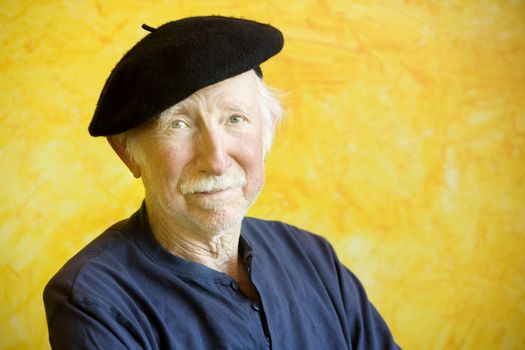 Portrait of an elderly painter wearing a beret 