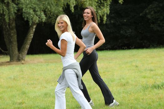Two young women in sports outdoor