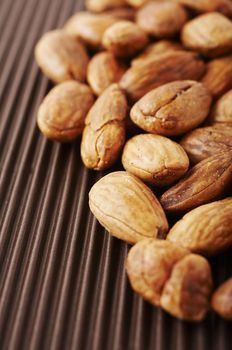 Roasted and sea salted almond nuts close-up 