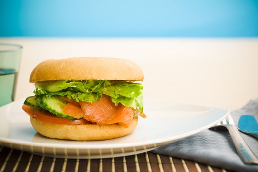 Cold smoked salmon bagel on the table