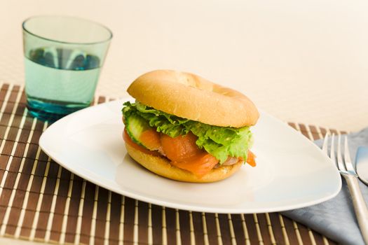 Cold smoked salmon bagel on the table