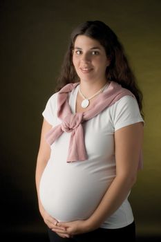 Seven month pregnant women smiling