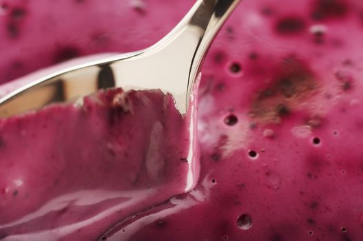 close-up of spoon in the blueberry mousse