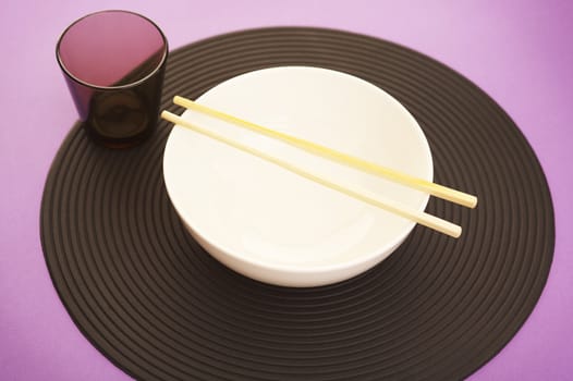 Empty rice bowl on the modern purple kitchen table 