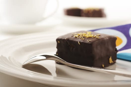 Chocolate cake and spoon on the coffee table