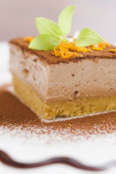 Mocca cheese cake with jam on coffee table (very shallow dof)
