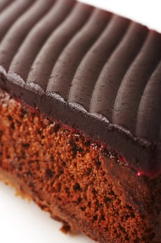 Chocolate cake with red jelly on the coffee table